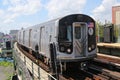 NYC Subway Q Train arrives at West 8 Street Station in Brooklyn Royalty Free Stock Photo