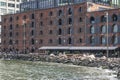 Brooklyn, New York: People relaxing at a cafe in a converted warehouse on the Brooklyn waterfront Royalty Free Stock Photo