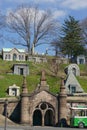 Brooklyn, New York: A trolley waits for passengers below obelisks and mausoleums