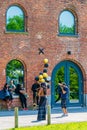 Brooklyn, New York, USA - May 19, 2019: Man taking pictures an African-American queen with yellow and black balloons, Brooklyn Royalty Free Stock Photo