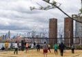 Brooklyn, NY - USA - April 17, 2021: A view of people enjoying a game of volley ball at Domino Park`s Beach Volleyball court. A