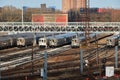 MTA Coney Island train yard with several parked nyc trains and skyscrapers visible in the background