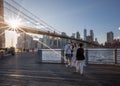 BROOKLYN, NYC - OCTOBER 08, 2019: Wedding photo shoot in Brooklyn Bridge Park in NYC. Bride and Groom with Photographer and