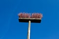 Broom against a dark blue sky