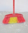 Broom besom on a concrete background