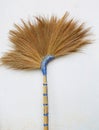 Broom or besom on the gray wall