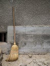 Broom or besom leaned at the wall. Royalty Free Stock Photo