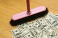 Broom, dollars, one Royalty Free Stock Photo