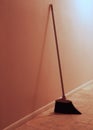 Broom leaning against wall