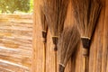 The broom is leaning against a wooden wall Royalty Free Stock Photo