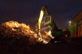 Broom. Loading scrap metal at night. Mechanisms for loading scrap metal. Hydraulic manipulator.