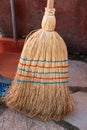 Broom. Old used corn straw broom. Professional natural organic large heavy duty broom. Cleaning tool for home, garden Royalty Free Stock Photo