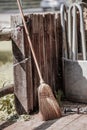 broom stand in backyard next to paddock on fence after clean up the garden and maintain the house with this witchcraft looking