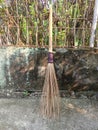 broom sticks from old coconut leaf bones with handmade bamboo stalks are still in demand todaybroom stick Royalty Free Stock Photo