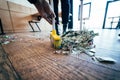 Broom sweeping dollars in scoop from on wooden floor Royalty Free Stock Photo