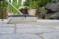 Broom Sweeping Sand into Pavers Low View Royalty Free Stock Photo