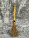 a broom that is usually used to sweep the yard of leaves Royalty Free Stock Photo