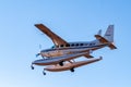 Broome, WA., Australia - Jul 8, 2012: A Cessna 208 Caravan amphibious float plane lands at Broome International Airport after a Royalty Free Stock Photo