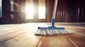 brooming a hardwood floor with white broom