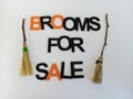 Brooms for sale Halloween sign on a white background