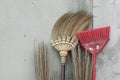 Brooms stick on brick wall Royalty Free Stock Photo