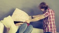 Man and woman having pillow fight