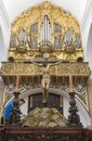 Brother member cleaning preparing a Easter Throne. Church of San Bartolome, Jerez de los Caballeros, Spain