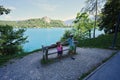 Brother with sister against view of beautiful Bled Castle with Lake Bled, Slovenia Royalty Free Stock Photo