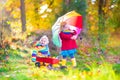 Brother and sister in an autumn park Royalty Free Stock Photo