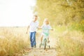 Brother and sister on autumn road Royalty Free Stock Photo