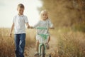 Brother and sister on autumn road Royalty Free Stock Photo