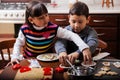 Brother and sister baking cookies