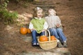 Brother and Sister Children Sitting on Wood Steps with Pumpkins Royalty Free Stock Photo