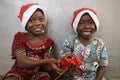 Brother and Sister With Christmas Hats Celebrating Christmas Together