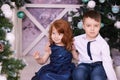 Brother and sister. Christmas interior. Small children. Horizontal
