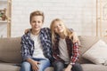 Brother And Sister Embracing Smiling Sitting On Couch At Home Royalty Free Stock Photo