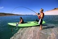 Brother and Sister Fishing and Kayaking Royalty Free Stock Photo