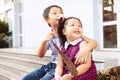 Brother and sister having fun and smiling outdoor together. Happy asian family with their children Royalty Free Stock Photo