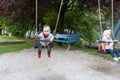 Brother and Sister Having Fun on a Swing Royalty Free Stock Photo