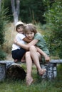 Brother and sister hug. Children play in nature Royalty Free Stock Photo