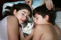 Brother sister lay with cat close up portrait