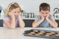 Brother and sister looking at tempting cookies