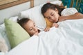 Brother and sister lying on bed sleeping at bedroom Royalty Free Stock Photo