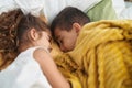 Brother and sister lying on bed sleeping at bedroom Royalty Free Stock Photo