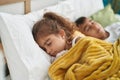 Brother and sister lying on bed sleeping at bedroom Royalty Free Stock Photo