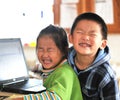 Brother and sister with notebook