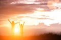 Brother and sister outdoors at sunset, silhouette concept