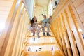 Brother with sister in pajama sit on stairs in cozy wooden tiny cabin house. Life in countryside Royalty Free Stock Photo