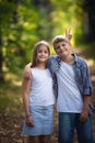 Brother and sister play, laugh, fool around and make grimaces and funny faces together. Little boy and girl, friends Royalty Free Stock Photo