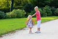 Brother and sister playing in autumn park Royalty Free Stock Photo